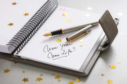 Image of a open agenda and pen with the event "New year, new life" annotated in the first day of the year.